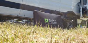 Zamp Solar Portable Next to a Van