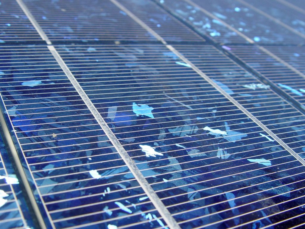 Polycrystalline solar panel showing the flakes of solar wafer in a cell.
